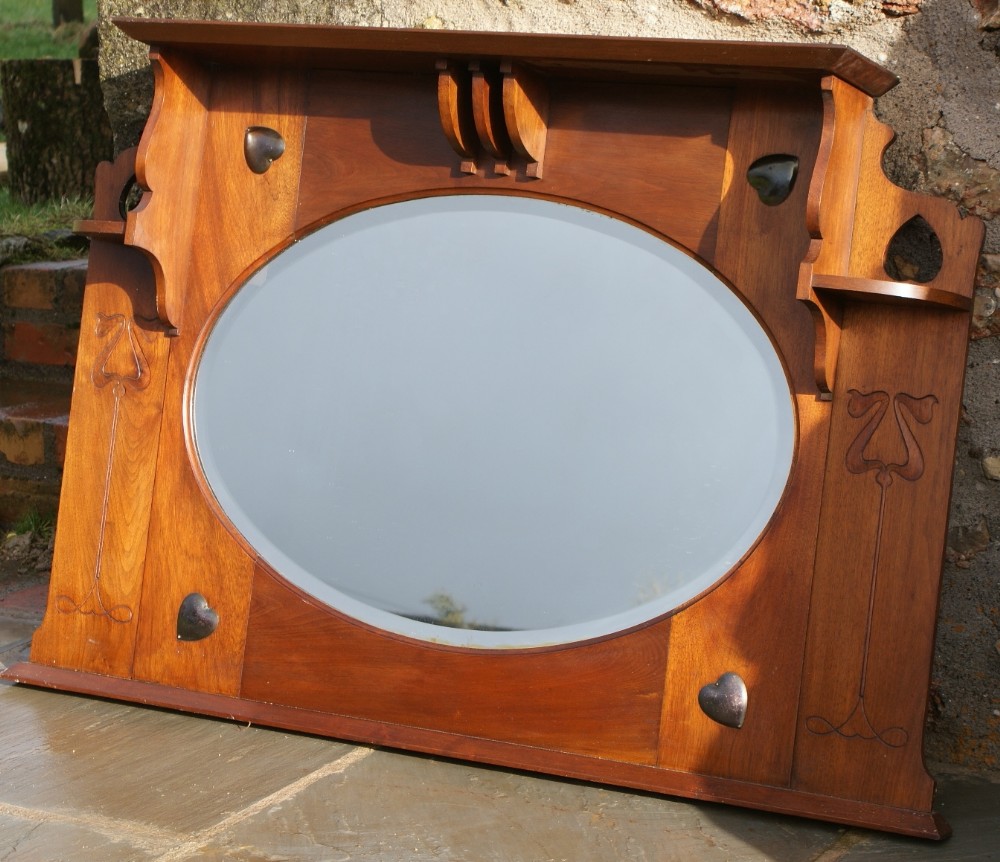 a very pretty art nouveau walnut over mantle mirror