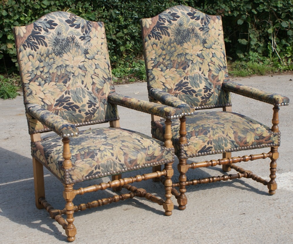 a pair of strong french early 20th century upholstered arm chairs