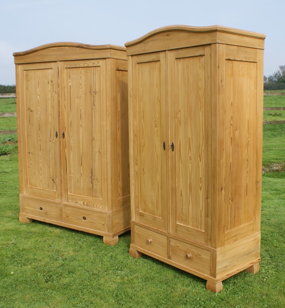 a fine pair of early 20th century antique german solid pine armoire's wardrobes